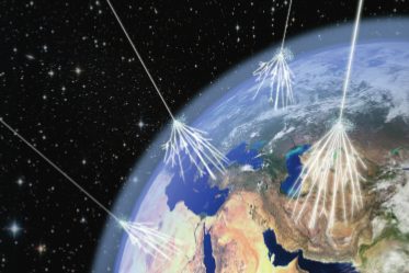 artist's view of cosmic rays hitting the earth